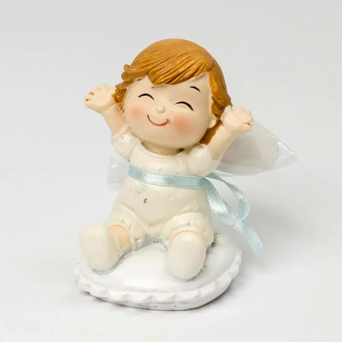 Figura bebé Pop and Fun sentada en cojín con 3 peladillas de chocolate