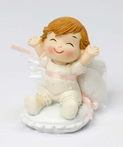 Figura bebé Pop and Fun sentada en cojín con 3 peladillas de chocolate