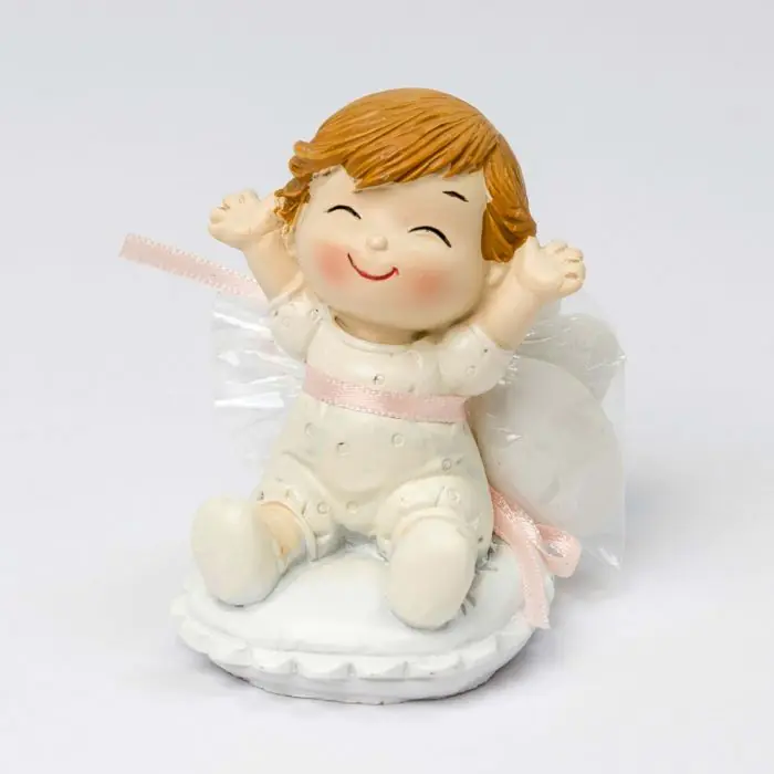 Figura bebé Pop and Fun sentada en cojín con 3 peladillas de chocolate