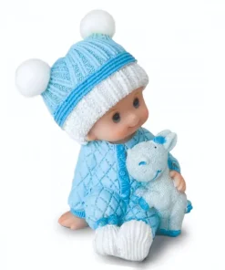 Figura pastel niño bebé en pijama sentado con peluche